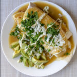 Hatch green chile enchilada with avocado