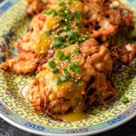 close up of chicken egg foo young on platter