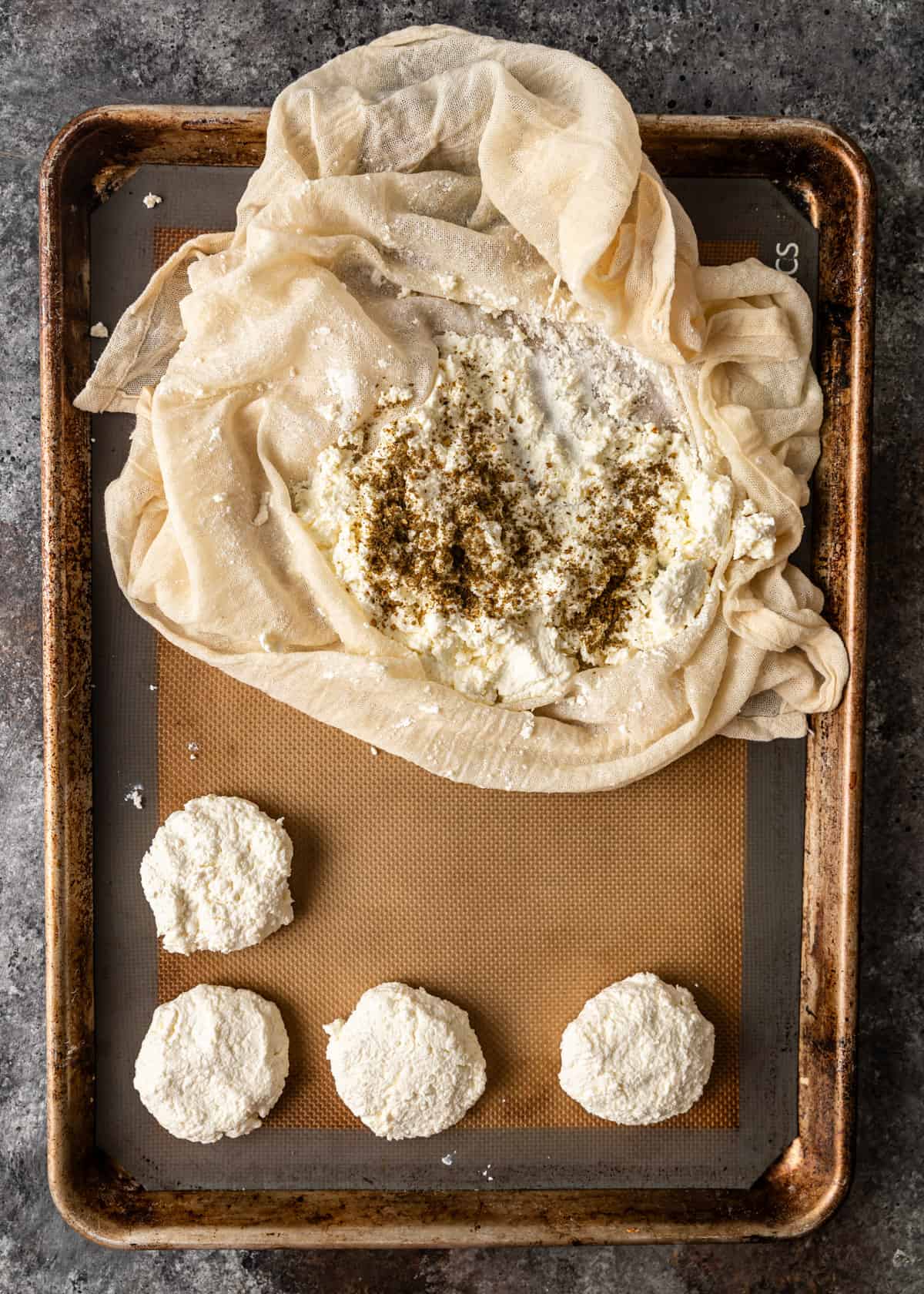 overhead process shot: forming the jibin cheese balls on a baking sheet