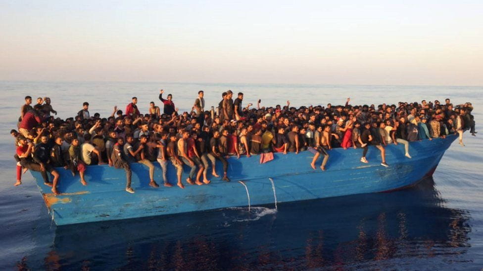 Migrants fill an entire boat which is on route to Italy