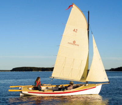 Man and woman sailing in a NorseBoat.