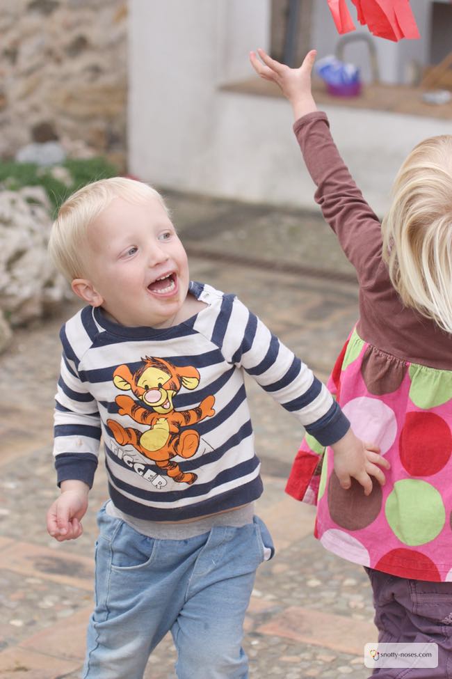 Easy Tissue Paper wind Sock Activity. My kids loved making these wind sock kites. They were super easy and super fun.