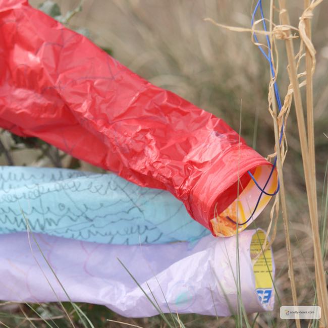 Easy Tissue Paper wind Sock Activity. My kids loved making these wind sock kites. They were super easy and super fun.