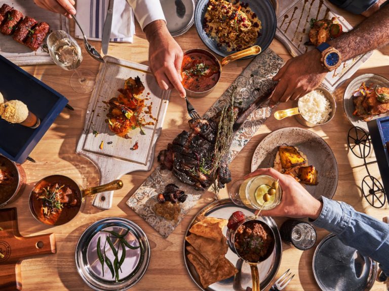 Khan Saab table with many dishes of food