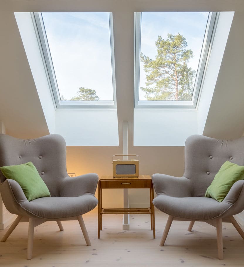 Two chairs underneath a skylight