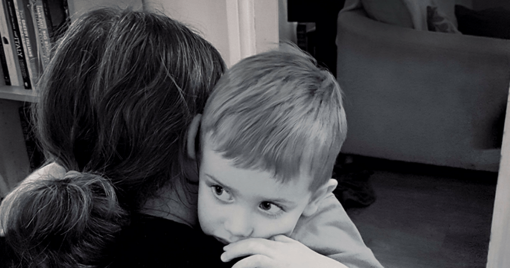 Boy hugging his mother. Photo by Someone's Mum