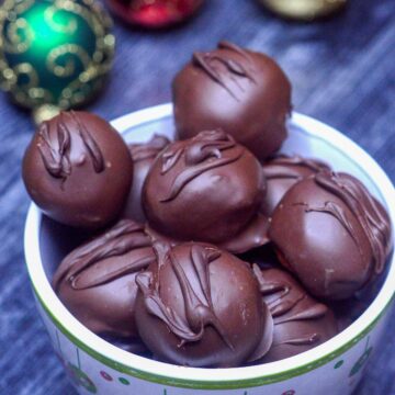 Chocolate Covered Peanut Butter Balls aka Peanut Butter Truffles. An easy 4 ingredients treat. Perfect for the holidays.