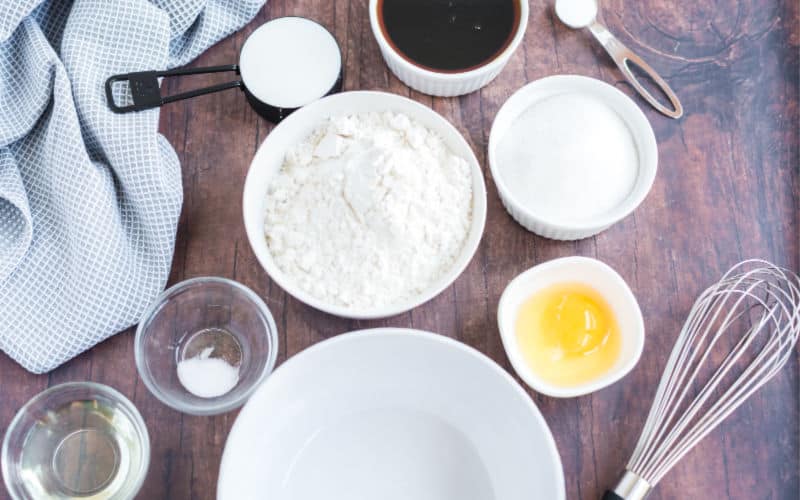 ingredients for the syrup cake on a wooden table