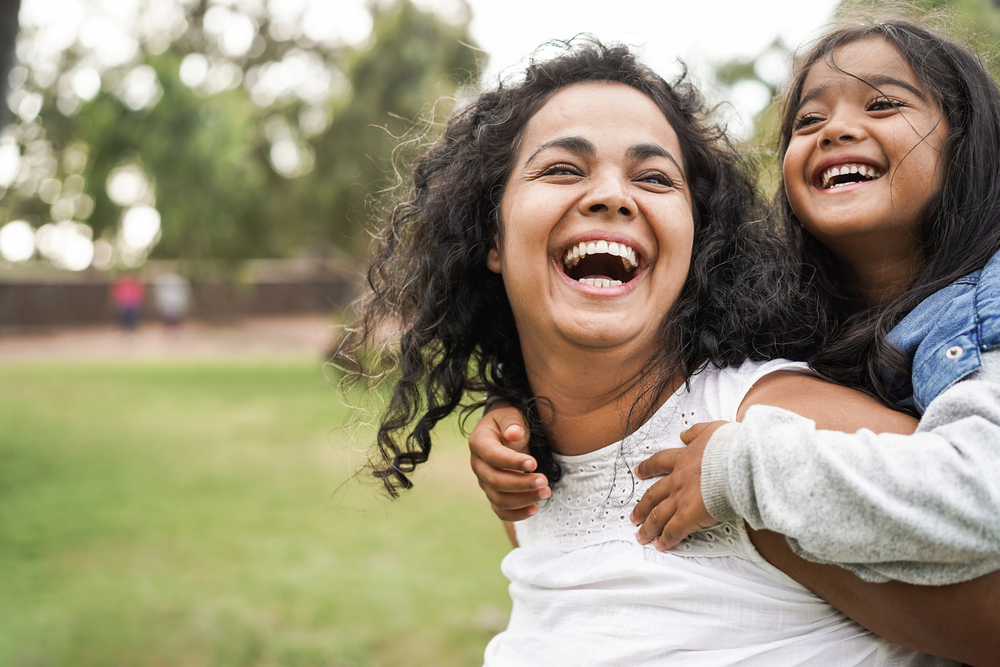 a girl and momma playing in a park in DC 