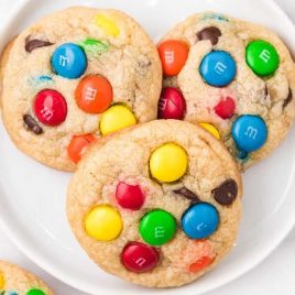 close up overhead shot of a plate of m&m cookies