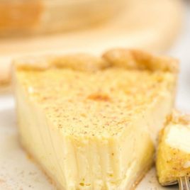 close up shot of custard pie on a white plate