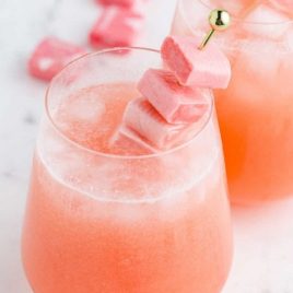 pink starburst cocktail with starburst candy in a glass