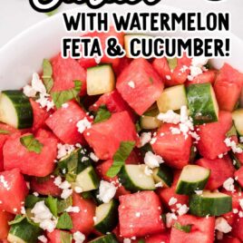 close up overhead shot of a serving of watermelon salad topped with mint leaves and feta cheese in a bowl