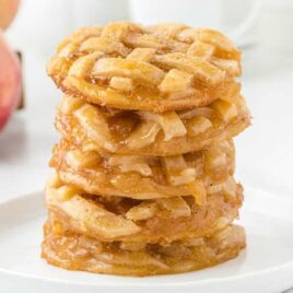 Apple Pie Cookies stacked on top of each other on a plate