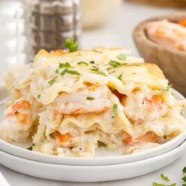 close up shot of a slice of Seafood Lasagna on a plate