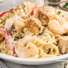 A close up of a plate of food, with Carbonara and Chicken