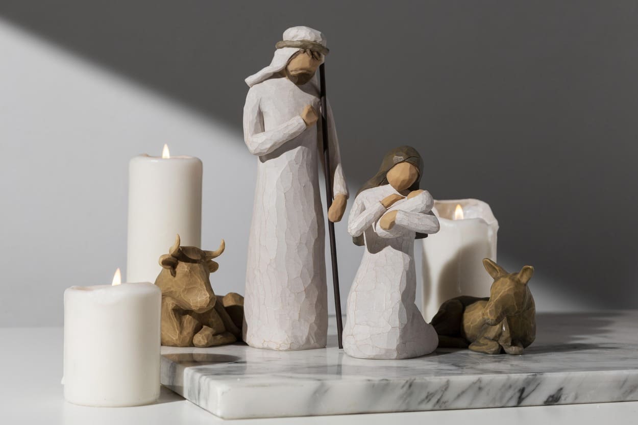 Minimalist nativity scene with candles and animal figures