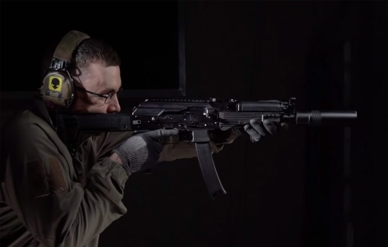 A man shooting from PPK-20 submachine gun