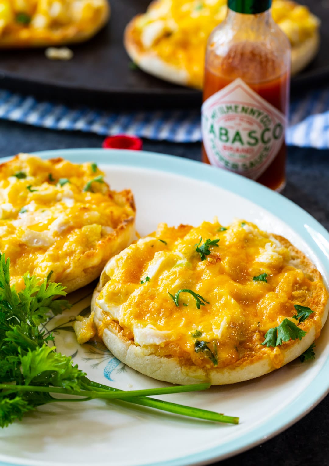 Two Crab Melts on a plate.