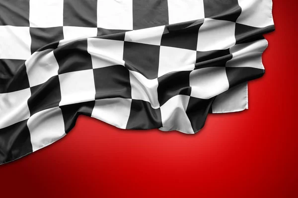 Checkered black and white flag on red background