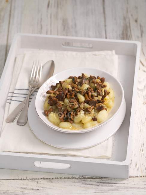 Elevated view of Gnocchi with chanterelle mushroom sauce — Stock Photo