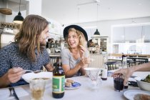 Friends having food in restaurant — Stock Photo