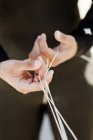 Man in wetsuit holding strings — Stock Photo