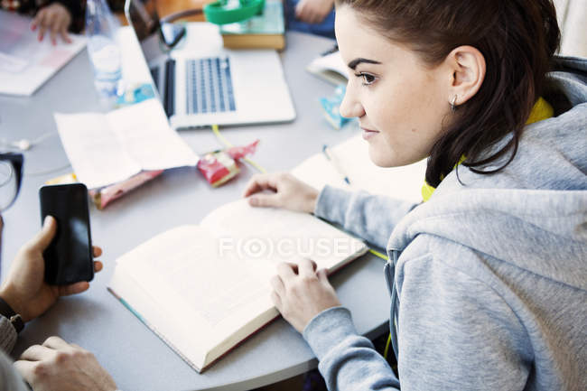 Young woman with books — Stock Photo