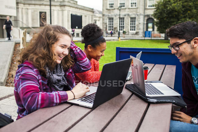 Smiling university students — Stock Photo