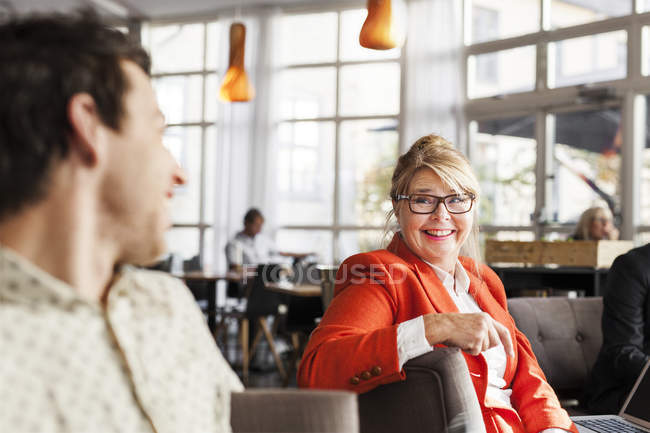 Happy business people discussing — Stock Photo