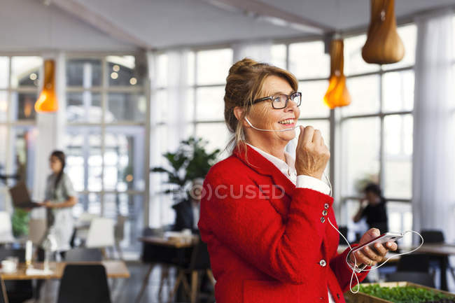 Appy businesswoman talking in restaurant — Stock Photo