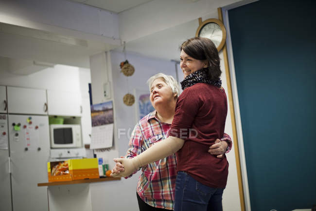 Healthcare worker dancing with woman — Stock Photo