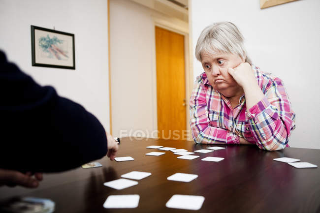 Woman with down syndrome looking at friend — Stock Photo