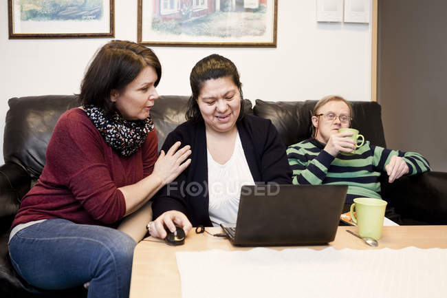 Healthcare worker helping woman — Stock Photo