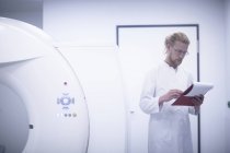 Radiologist checking notes in radiology room. — Stock Photo