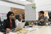 Young multicultural business people working together in modern office — Stock Photo