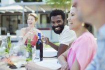 Friends talking at party — Stock Photo