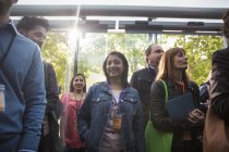 Portrait smiling woman arriving at conference — Stock Photo