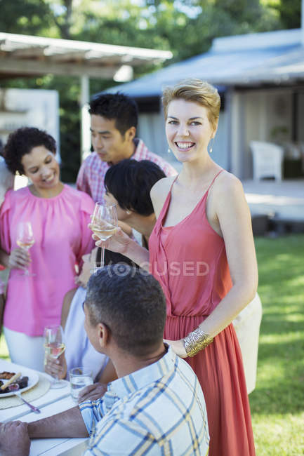 Woman smiling at party outdoors — Stock Photo