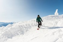 Skier skiing on a snowy mountain during winter — Stock Photo