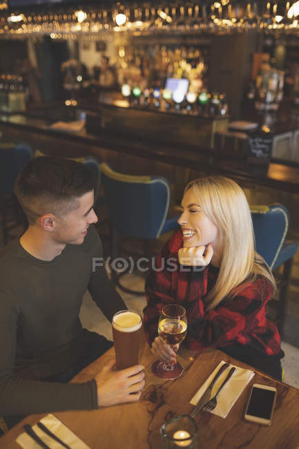 High angle view of couple having drinks in restaurant — Stock Photo