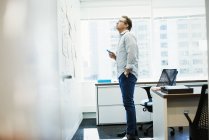 Man standing in office — Stock Photo