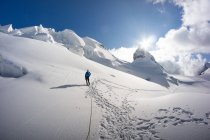 Man walking on glacier in the Swiss Alps, Piz Bernina, Graubunden, Switzerland — Stock Photo