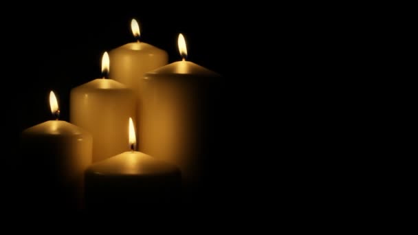 Five flickering candles on the black background. — Stock Video © 42pixels  #63151453