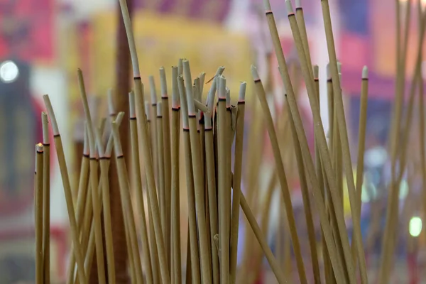 many incense sticks  were lit to perform religious ceremony in Shrine, Asian beliefs about Buddhist rituals,