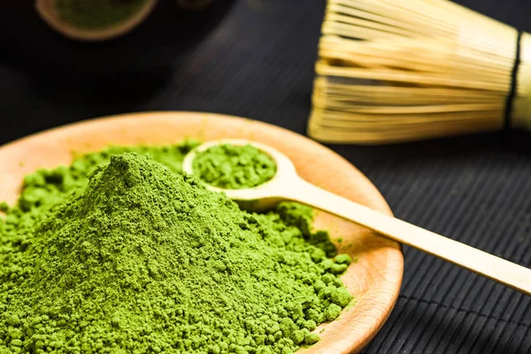 Matcha green powder and bamboo tea whisk