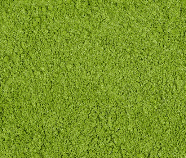 Background of green powder, border surface close up of powdered