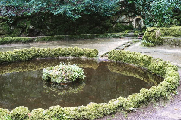 Cute fairy garden along the Valley of Lakes trail in Sintra, Portugal