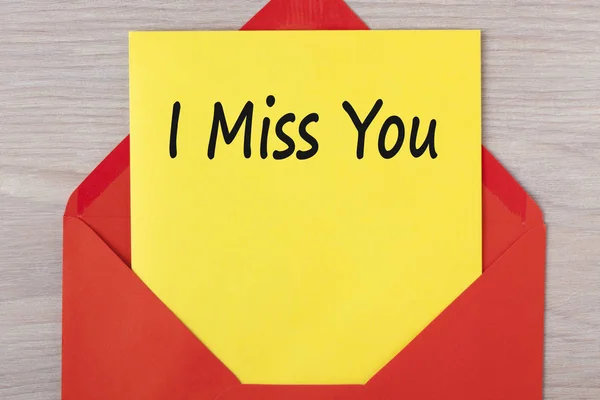 I Miss You written on letter in red envelope.