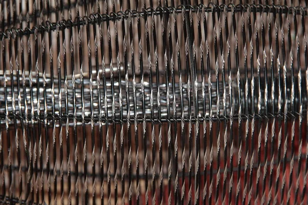 Texture of an iron mesh with a diamond cut.